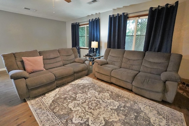 465 Mike Ct, Lemoore, CA 93245 - living area with wood finished floors, ceiling fan, and baseboards
