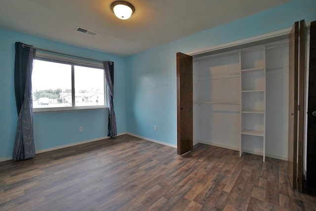 465 Mike Ct, Lemoore, CA 93245 - unfurnished bedroom featuring wood finished floors, baseboards, and a closet