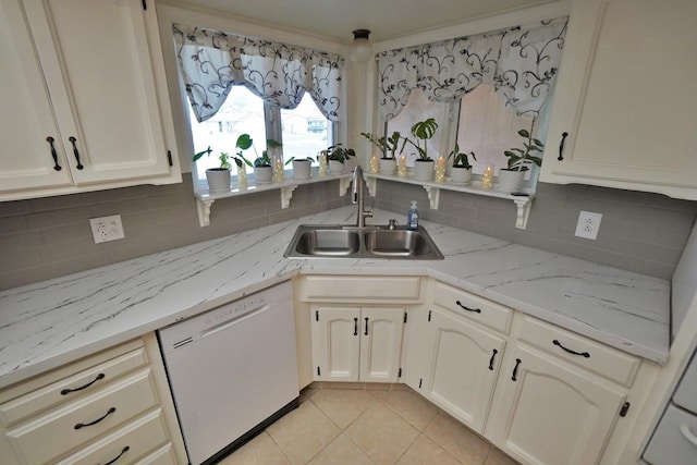 465 Mike Ct, Lemoore, CA 93245 - kitchen featuring dishwasher, a sink, decorative backsplash, and light tile patterned floors