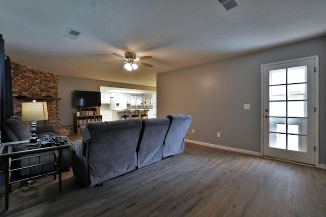465 Mike Ct, Lemoore, CA 93245 - living room featuring ceiling fan, wood finished floors, healthy amount of natural light, and baseboards