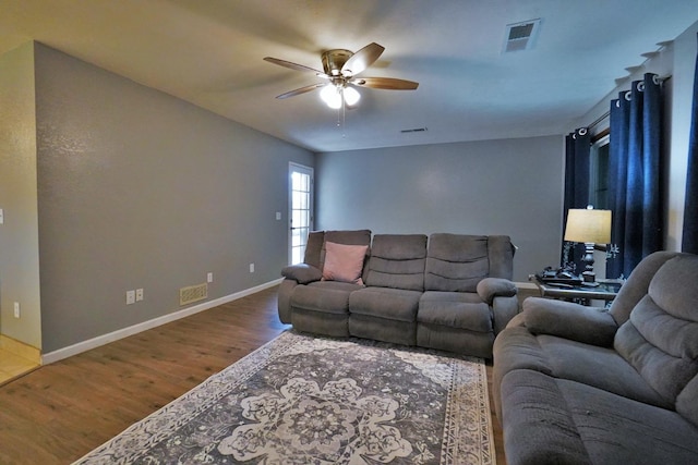 465 Mike Ct, Lemoore, CA 93245 - living room with wood finished floors, a ceiling fan, and baseboards