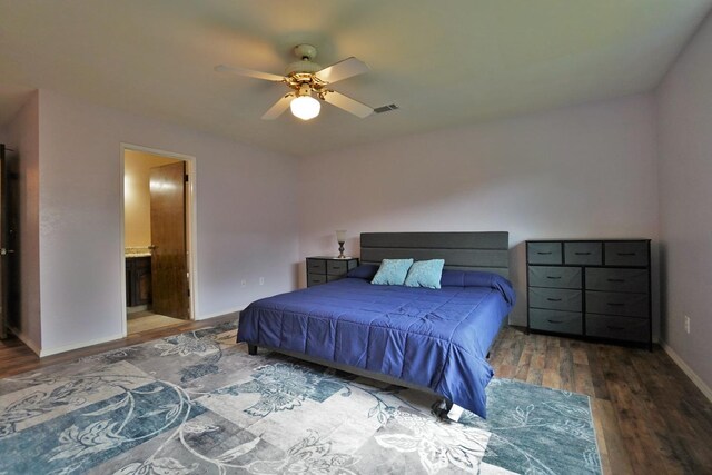465 Mike Ct, Lemoore, CA 93245 - bedroom with wood finished floors, baseboards, ensuite bath, and ceiling fan
