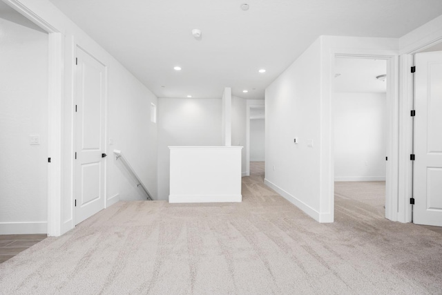 interior space with recessed lighting, baseboards, and light colored carpet