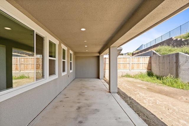 view of patio featuring fence