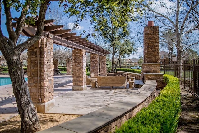 view of home's community with a patio area, fence, and an outdoor hangout area