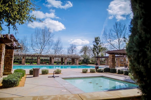 community pool featuring a patio area and a pergola