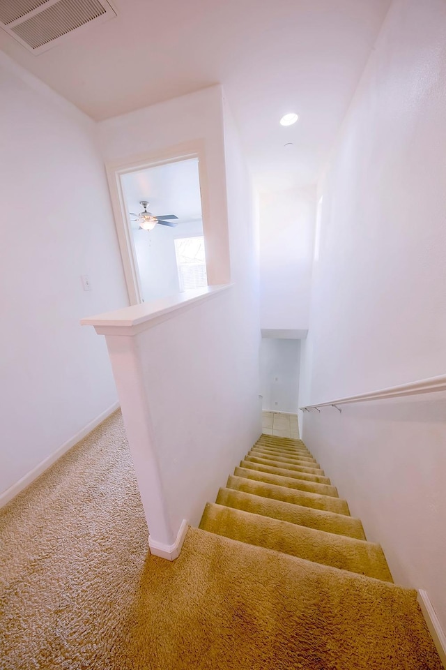 stairs featuring visible vents, baseboards, ceiling fan, carpet flooring, and recessed lighting