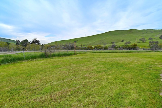 mountain view featuring a rural view