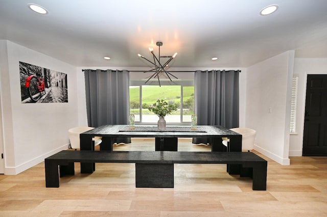 dining room with baseboards, light wood-type flooring, and recessed lighting