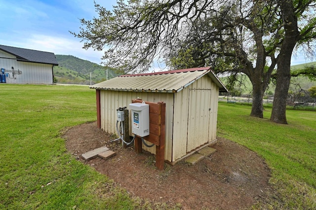 view of shed featuring a mountain view