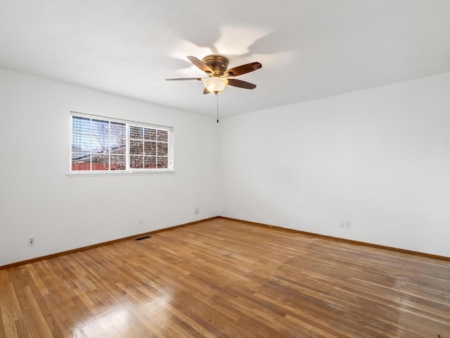 9414 E Belmont Ave, Sanger, CA 93657 - spare room with a ceiling fan and wood finished floors