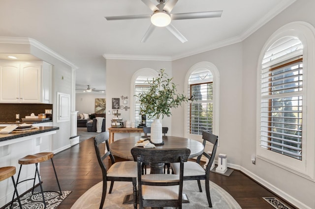 6136 E S Bear Creek Dr, Merced, CA 95340 - dining room featuring ceiling fan, dark wood-style floors, ornamental molding, and baseboards