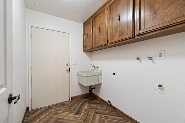 210 S Caesar Ave, Fresno, CA 93727 - washroom with cabinet space, hookup for an electric dryer, and baseboards