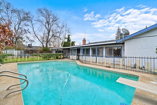 210 S Caesar Ave, Fresno, CA 93727 - view of swimming pool featuring fence and a diving board