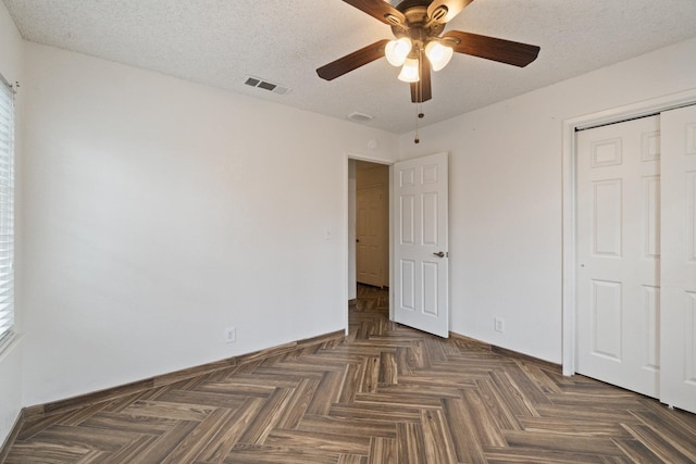 210 S Caesar Ave, Fresno, CA 93727 - unfurnished bedroom with baseboards, a closet, ceiling fan, and a textured ceiling
