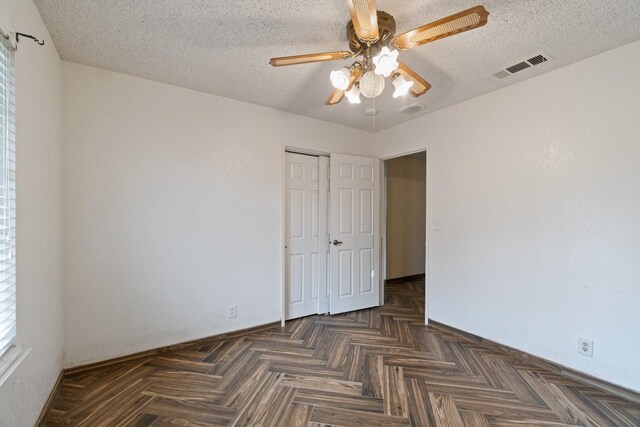210 S Caesar Ave, Fresno, CA 93727 - unfurnished bedroom featuring a closet, a textured ceiling, a ceiling fan, and baseboards