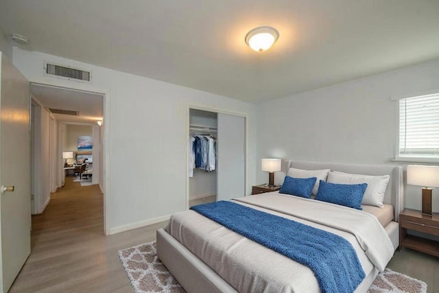 467 E San Bruno Ave, Fresno, CA 93710 - bedroom with wood finished floors, a closet, and baseboards