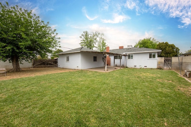 467 E San Bruno Ave, Fresno, CA 93710 - back of house with a gate, a patio, and a chimney