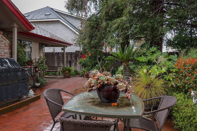4240 W Sierra Ave, Fresno, CA 93722 - view of patio / terrace with fence and outdoor dining space