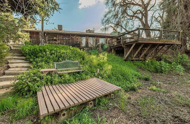 exterior space with stairway and a wooden deck