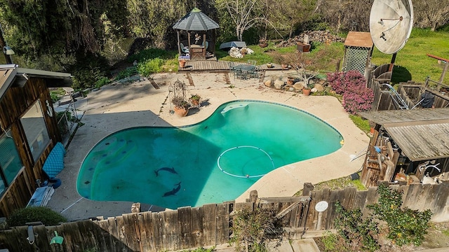 view of swimming pool featuring a patio, a fenced backyard, and a fenced in pool