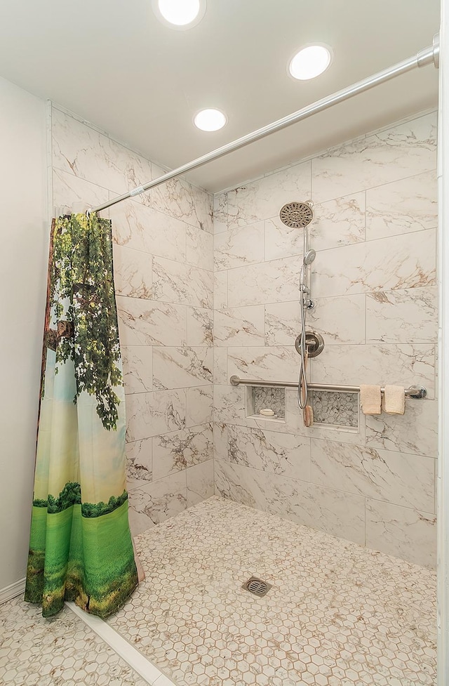 full bath with recessed lighting and a tile shower