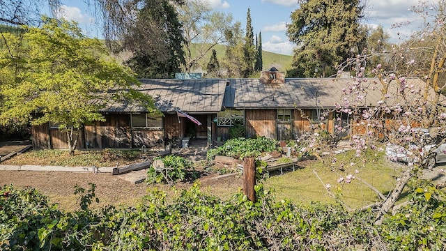 view of front of property with a vegetable garden