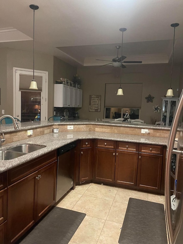 289 S Timberline Dr, Madera, CA 93637 - kitchen featuring dishwasher, a raised ceiling, ceiling fan, light tile patterned floors, and light stone countertops