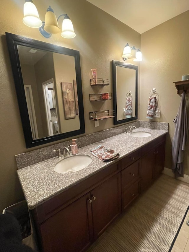 289 S Timberline Dr, Madera, CA 93637 - bathroom featuring double vanity and tile patterned flooring