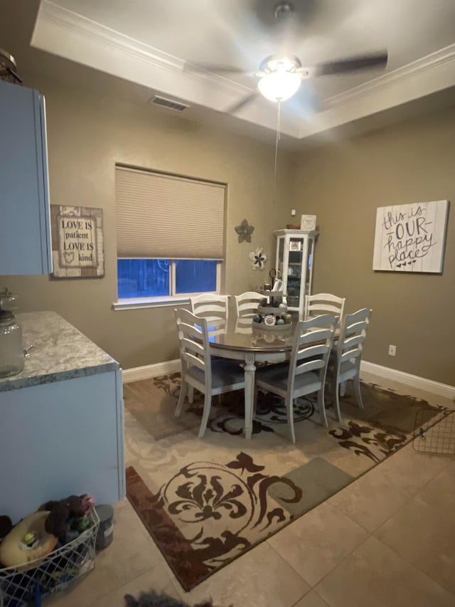 289 S Timberline Dr, Madera, CA 93637 - dining space featuring crown molding, a raised ceiling, ceiling fan, and light tile patterned flooring