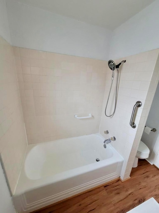 347 Coolidge St, Coalinga, CA 93210 - full bath with toilet, tub / shower combination, and wood finished floors