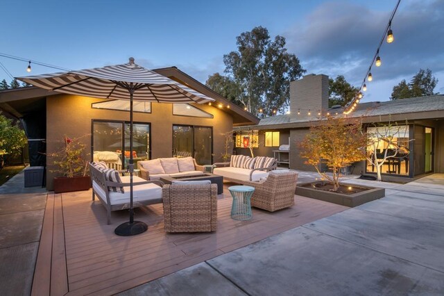 view of patio / terrace featuring outdoor lounge area and a deck
