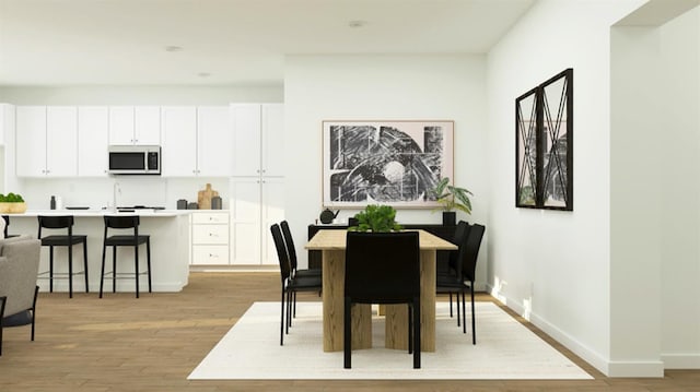 1260 Bloom Ave Unit 34, Clovis, CA 93619 - dining room featuring light wood finished floors and baseboards