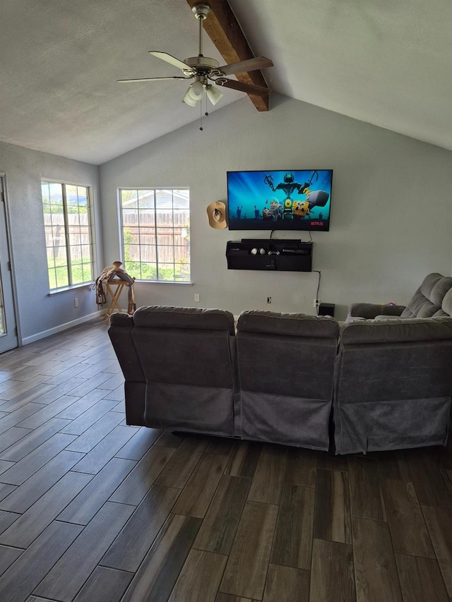 27261 Stanford Ave, Madera, CA 93637 - living area featuring dark wood finished floors, baseboards, vaulted ceiling with beams, and ceiling fan