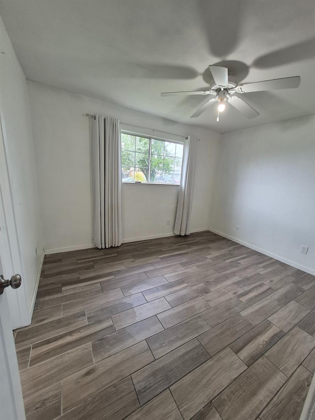 27261 Stanford Ave, Madera, CA 93637 - empty room with a ceiling fan and wood tiled floors