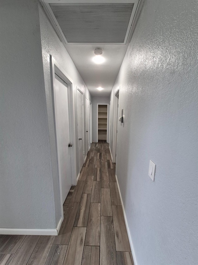 27261 Stanford Ave, Madera, CA 93637 - hallway featuring wood finished floors and a textured wall