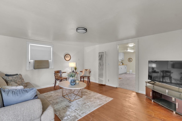 1417 Humboldt Ave, Chowchilla, CA 93610 - living room with a heating unit and wood finished floors
