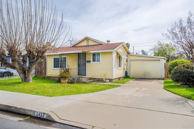 1417 Humboldt Ave, Chowchilla, CA 93610 - view of front of house featuring driveway and an outbuilding