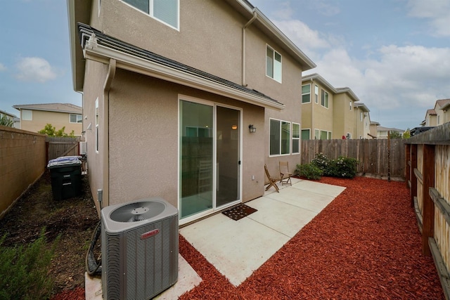 1935 Minarets Ln, Clovis, CA 93611 - rear view of property with a patio area, a fenced backyard, central AC, and stucco siding