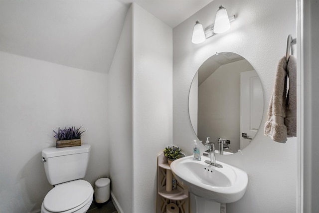 1935 Minarets Ln, Clovis, CA 93611 - half bath with a sink, toilet, and vaulted ceiling