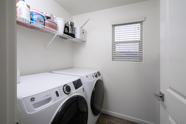 1935 Minarets Ln, Clovis, CA 93611 - clothes washing area featuring washer and dryer, baseboards, dark wood-style floors, and laundry area