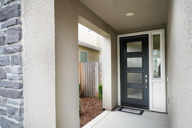 1935 Minarets Ln, Clovis, CA 93611 - view of exterior entry with stucco siding and fence