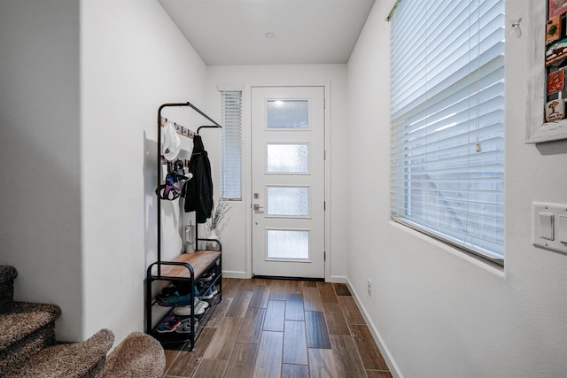1935 Minarets Ln, Clovis, CA 93611 - doorway with stairway, baseboards, and dark wood-style flooring