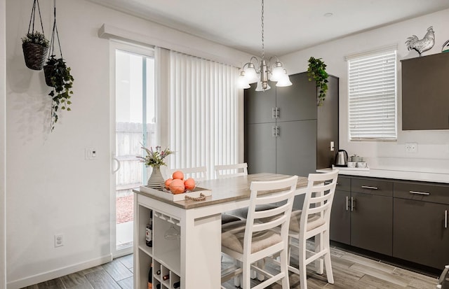 1935 Minarets Ln, Clovis, CA 93611 - dining room with light wood-style flooring and baseboards