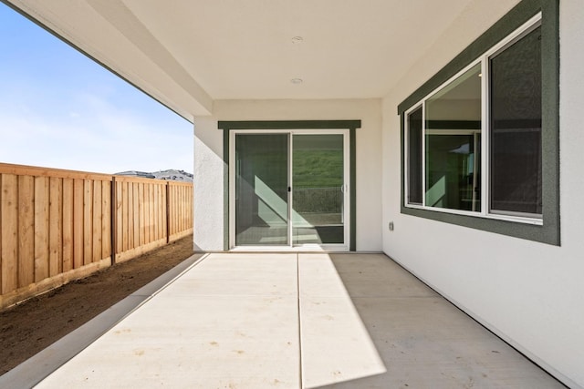 view of patio / terrace featuring fence