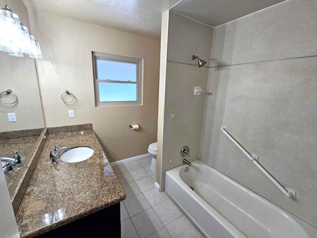 full bath featuring tile patterned floors, bathtub / shower combination, toilet, vanity, and baseboards