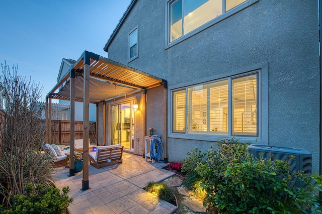 back of property featuring fence, central air condition unit, a patio area, stucco siding, and a pergola