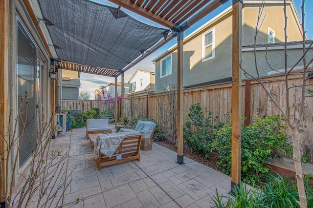 view of patio with a pergola, outdoor lounge area, and a fenced backyard