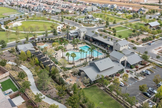 birds eye view of property with a residential view