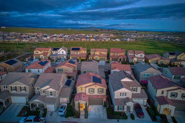 birds eye view of property with a residential view